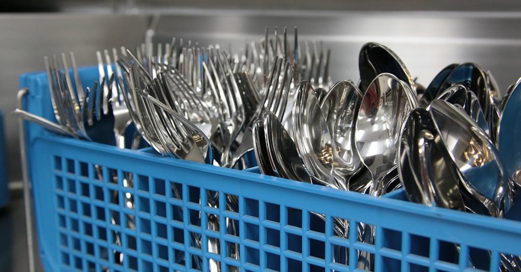 Silverware fresh out of a Commercial Dishwasher